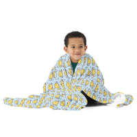 Boy wrapped in the Blue Little Chick throw blanket