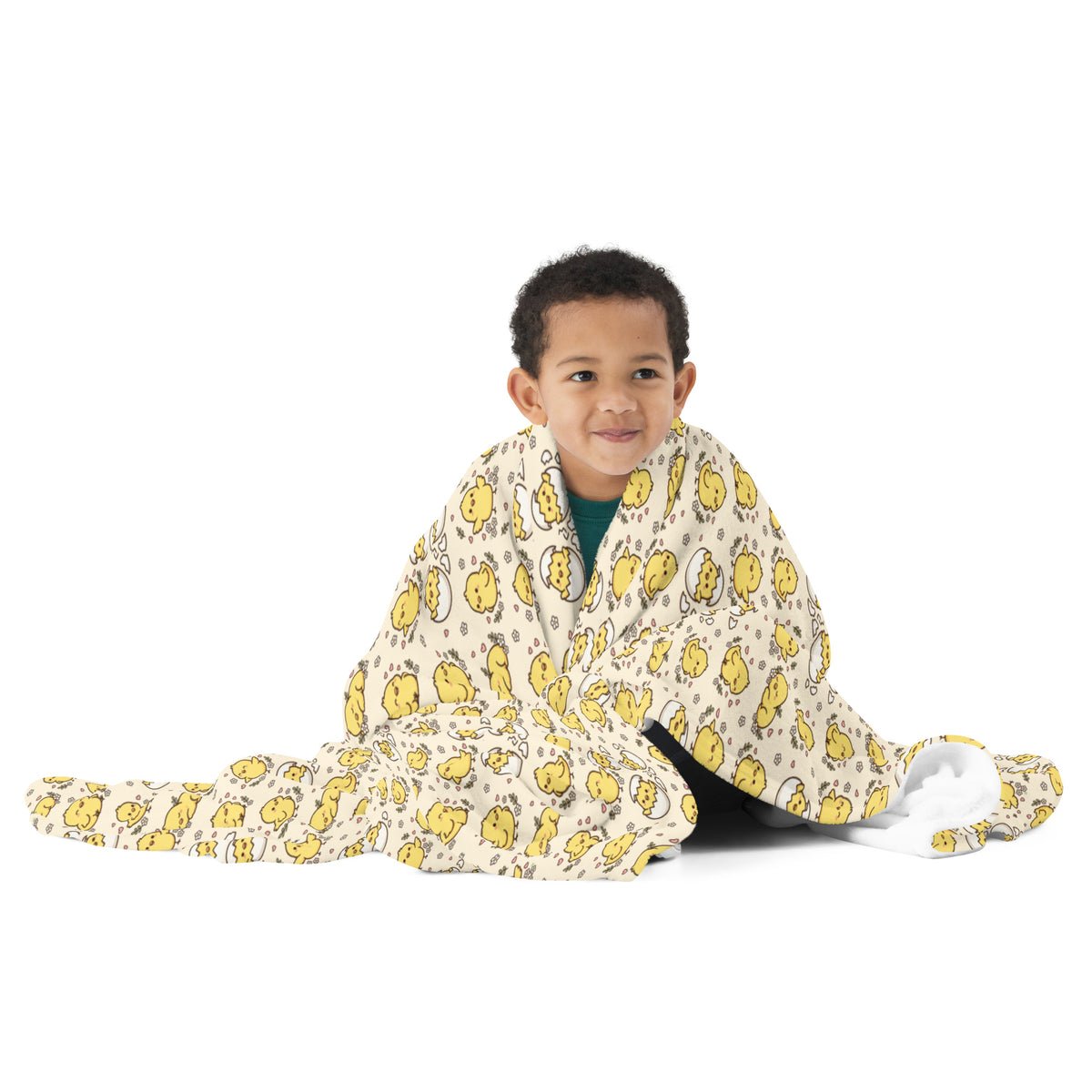 Boy wrapped in the Little Chicks throw blanket
