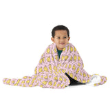Boy wrapped in the Pink Little Chick throw blanket
