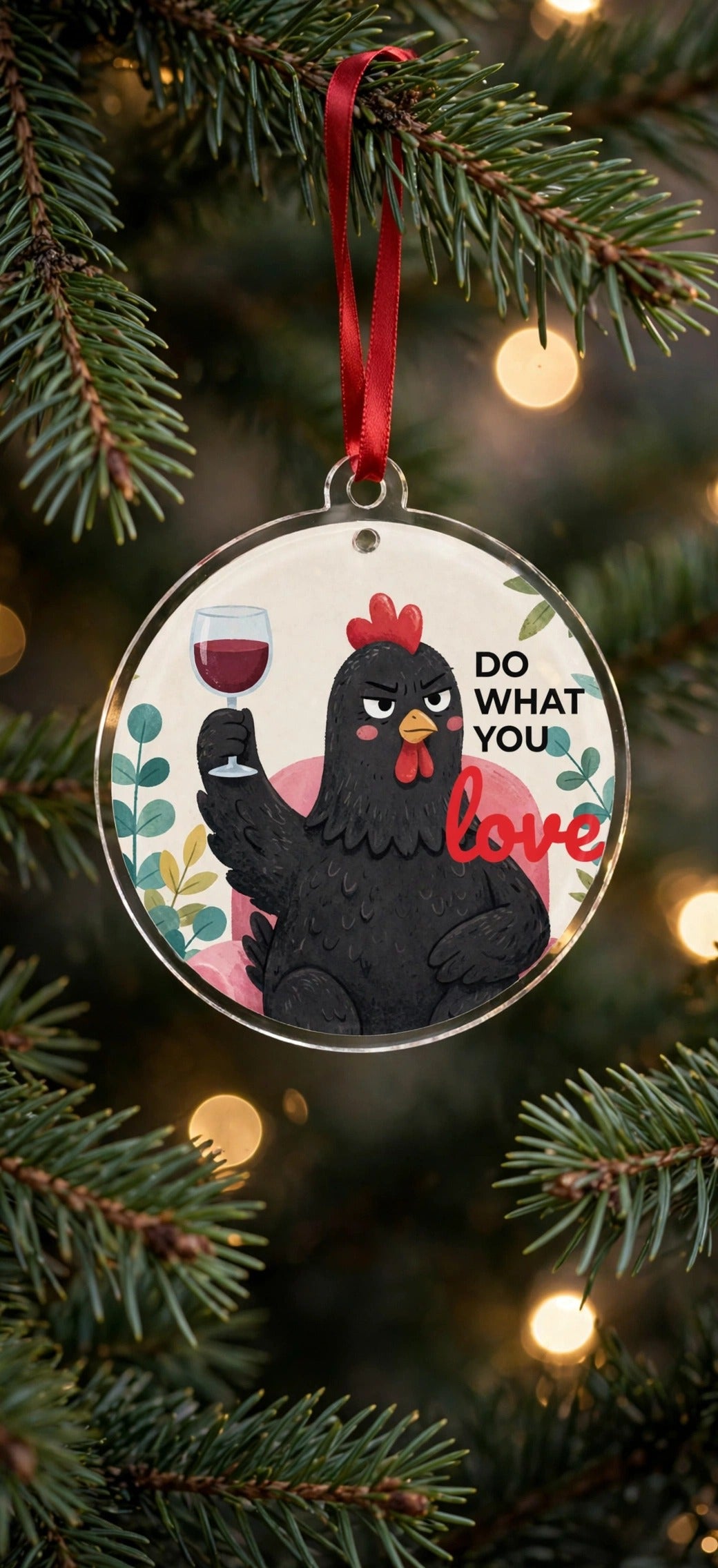 Black hen with wine glass acrylic Christmas ornament hanging on a Christmas tree